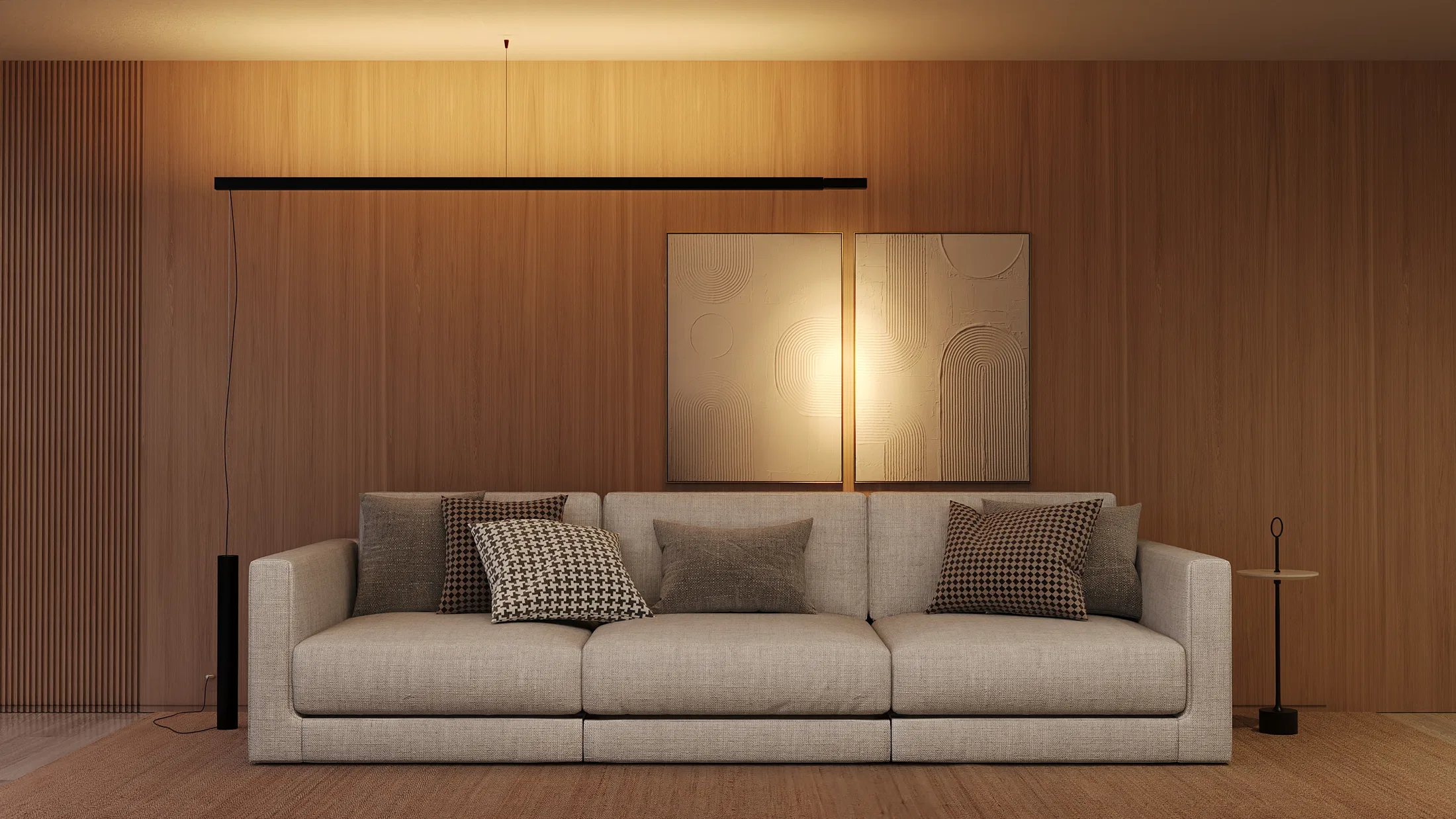 Sala de estar com sofá em linho claro, almofadas estampadas e dois quadros abstratos, sob linha de luz suspensa horizontal junto à parede de madeira.