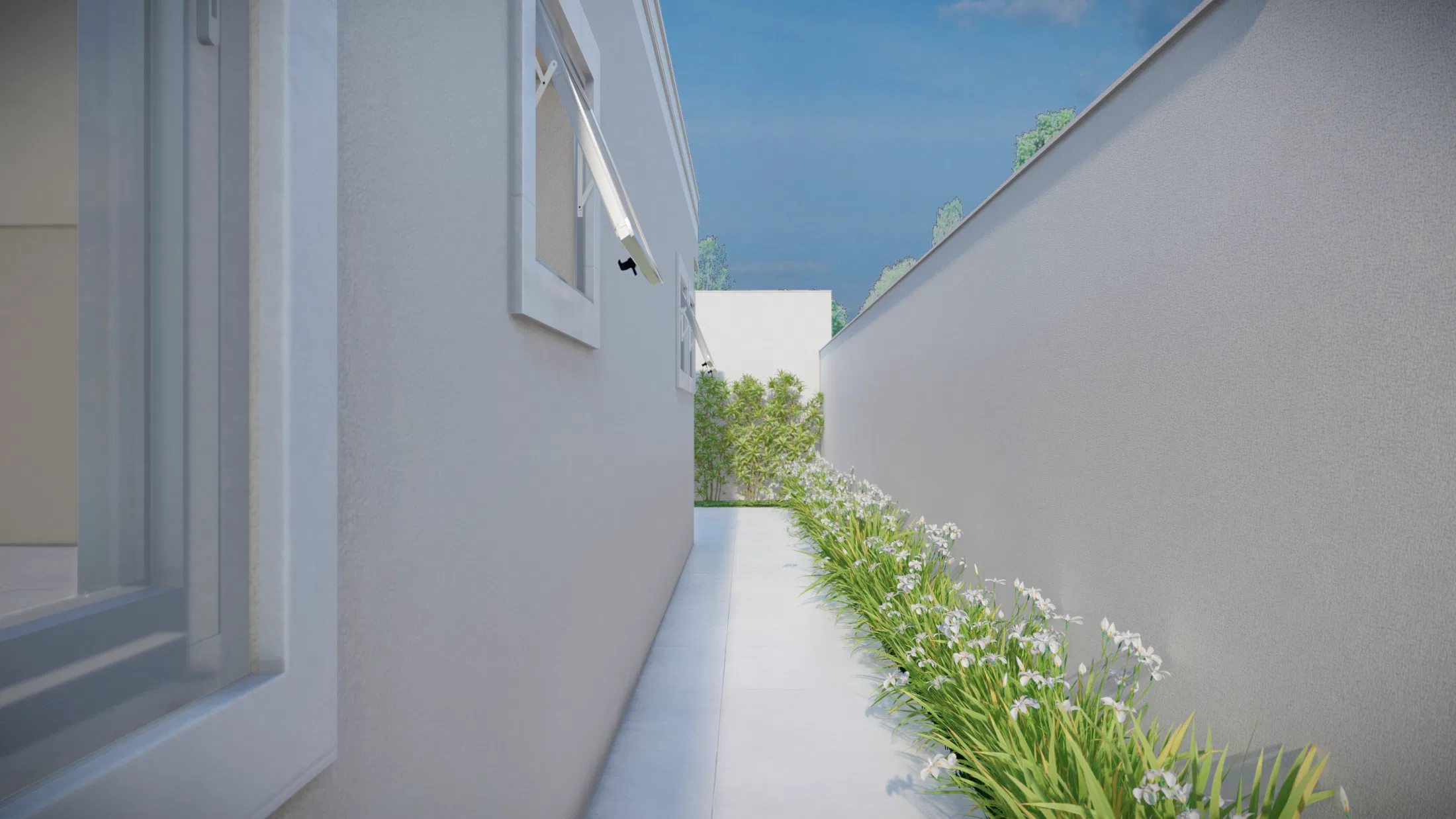 Passagem de serviço entre muros brancos, com faixa contínua de folhagens e flores brancas acompanhando o piso até o fundo iluminado