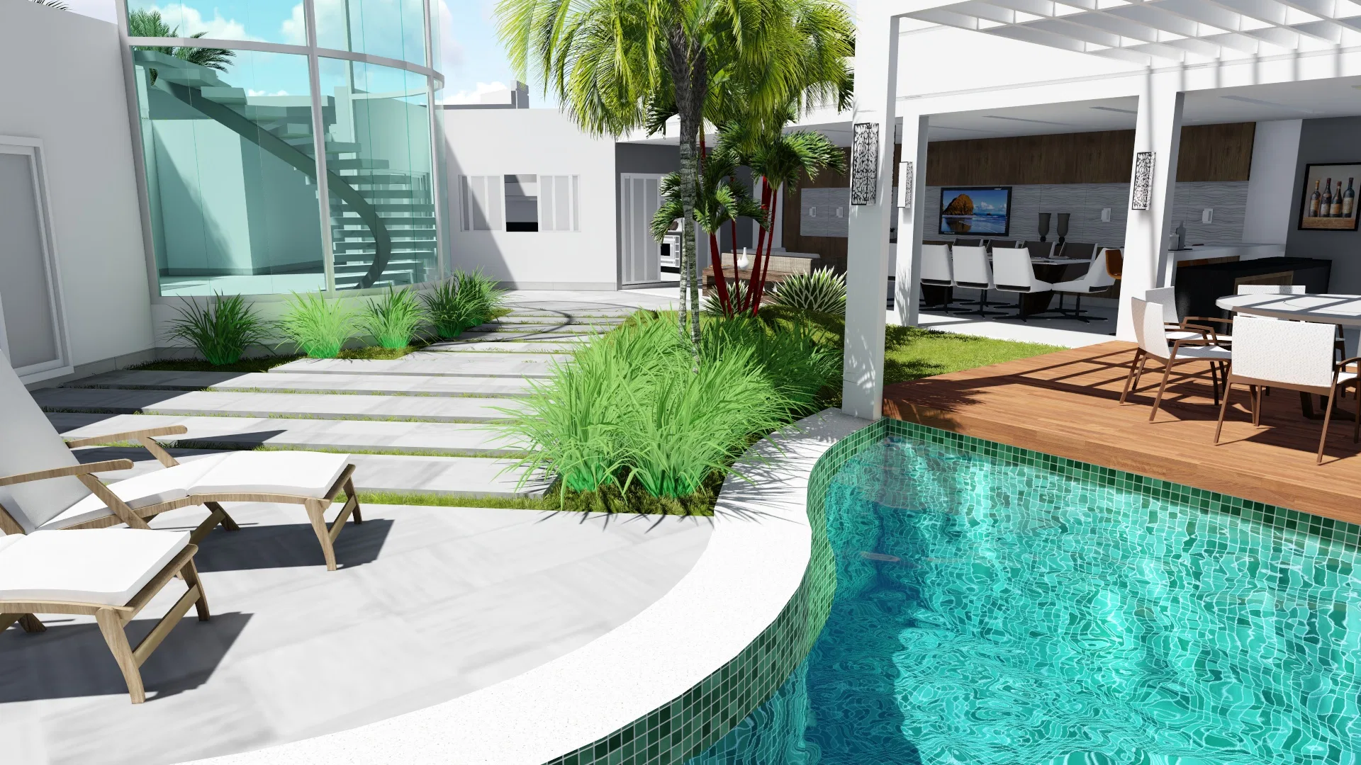 Espreguiçadeiras brancas no deck pavimentado à beira da piscina curva, com gramíneas, palmeira central e a área gourmet coberta com mesa e estar ao fundo