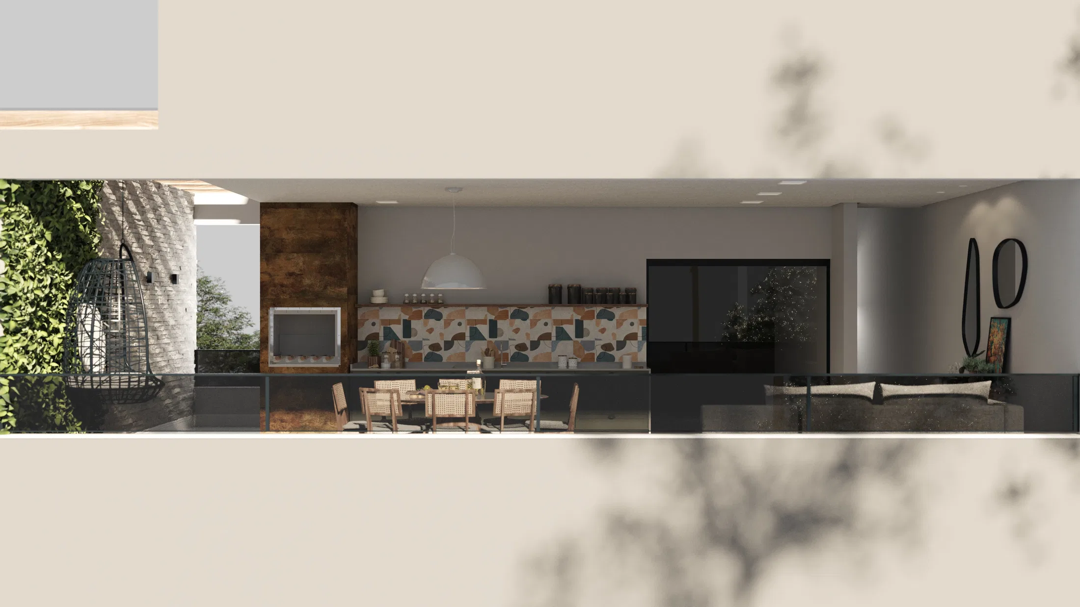 Varanda gourmet vista de cima, com parede verde viva, poltrona suspensa, mesa de jantar redonda e cozinha com revestimento em terrazzo