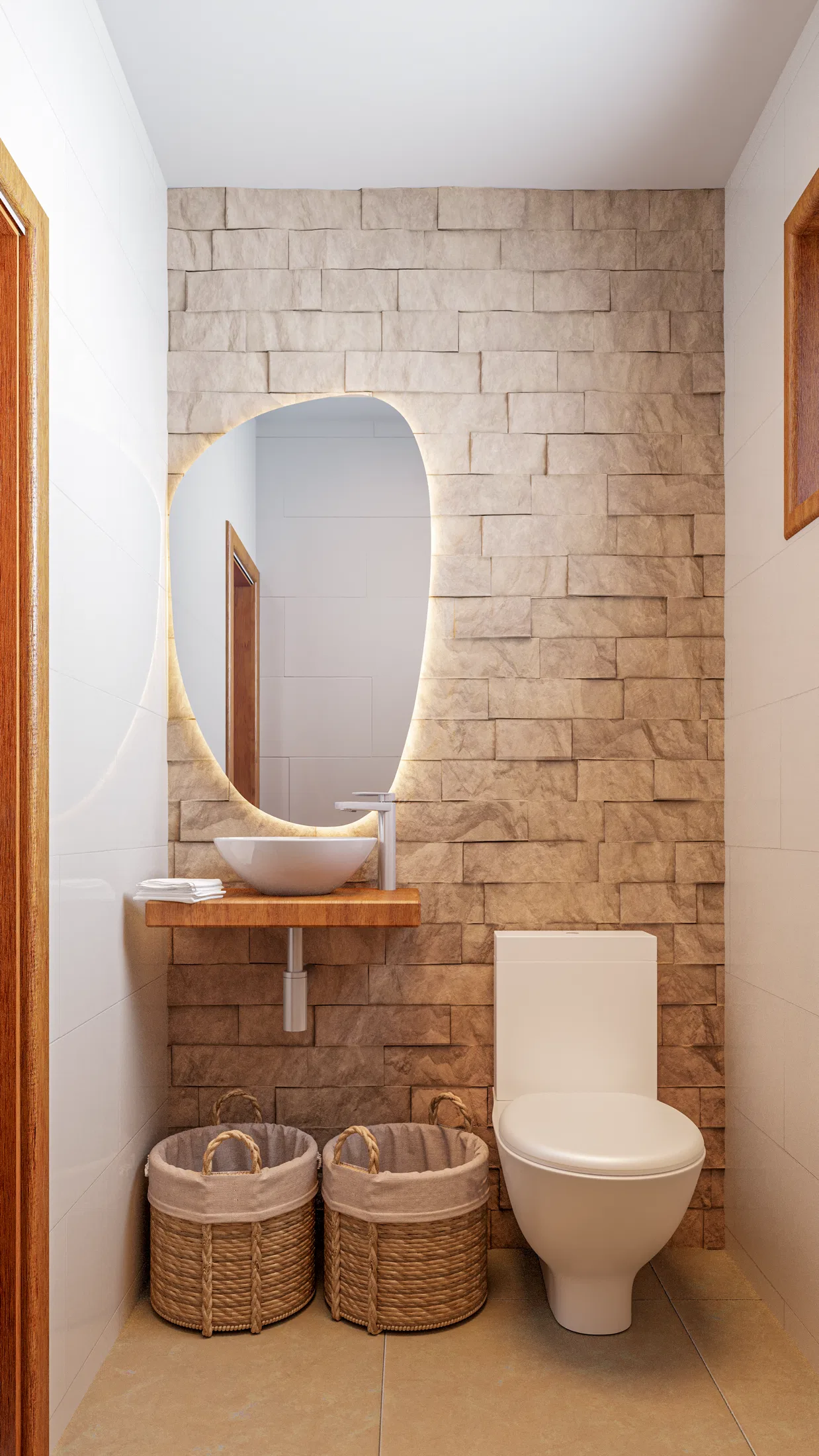 Lavabo com parede em pedra canjiquinha, espelho orgânico com iluminação embutida e cestos de fibra natural