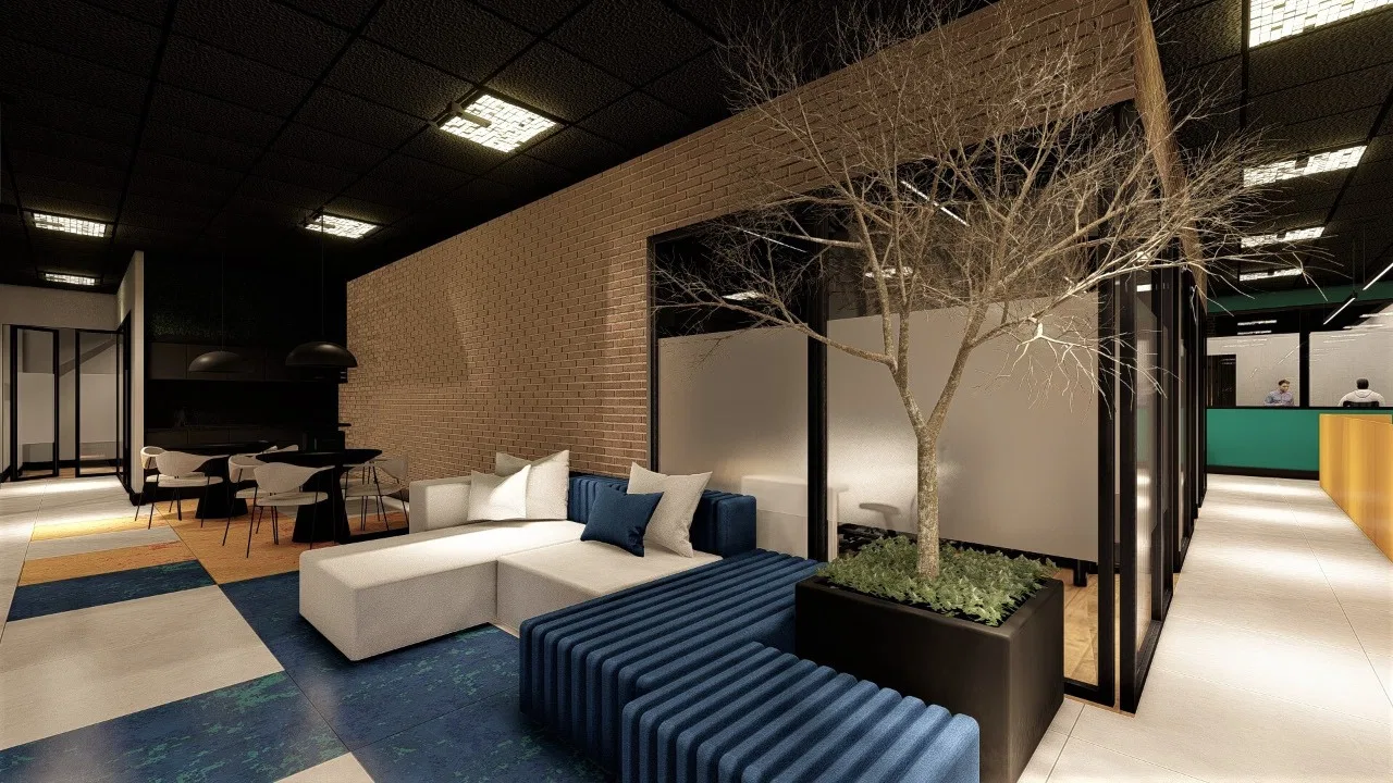Área de convívio com parede de tijolo, sofá branco em L e banco azul, árvore decorativa em jardineira e piso de carpete padronado