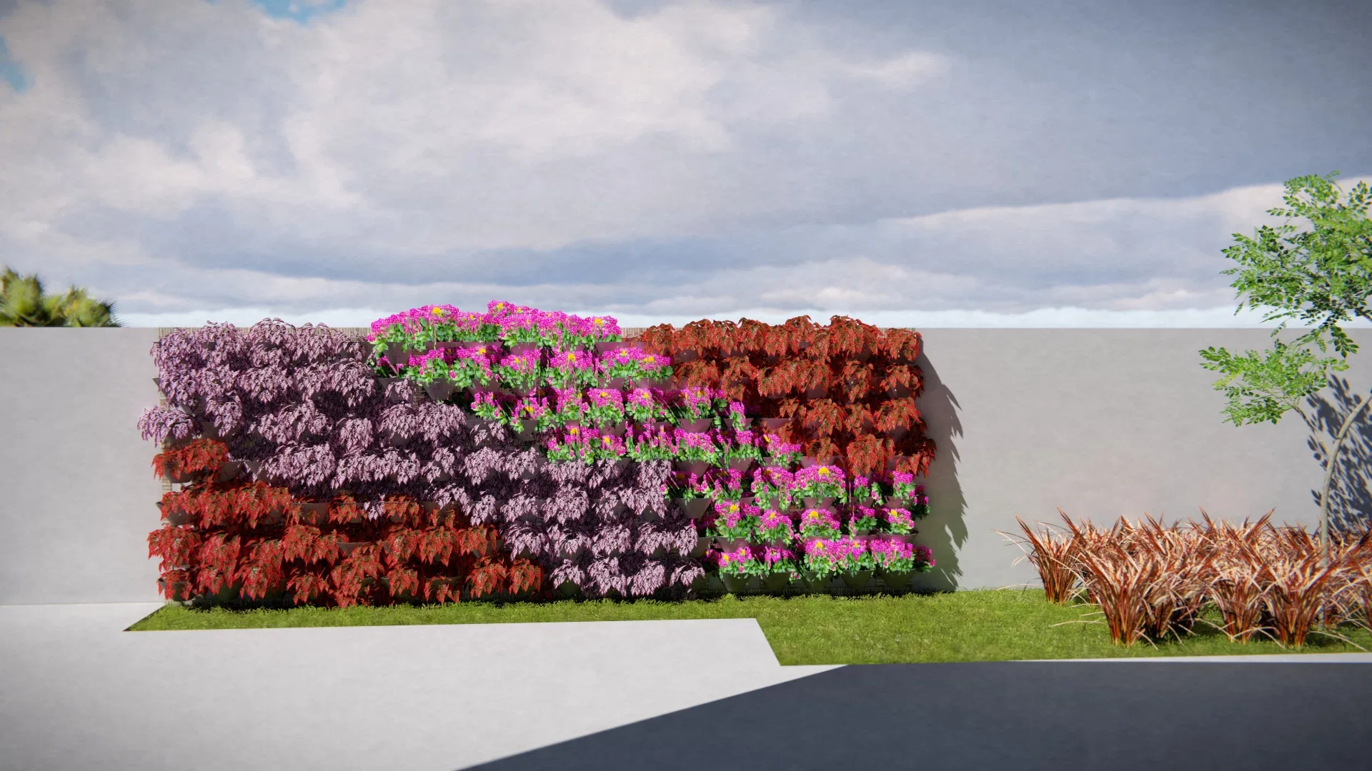 Painel vertical florido em mosaico de folhagens púrpura, flores magenta e folhas vermelhas sobre muro branco, com gramínea acobreada ao lado.
