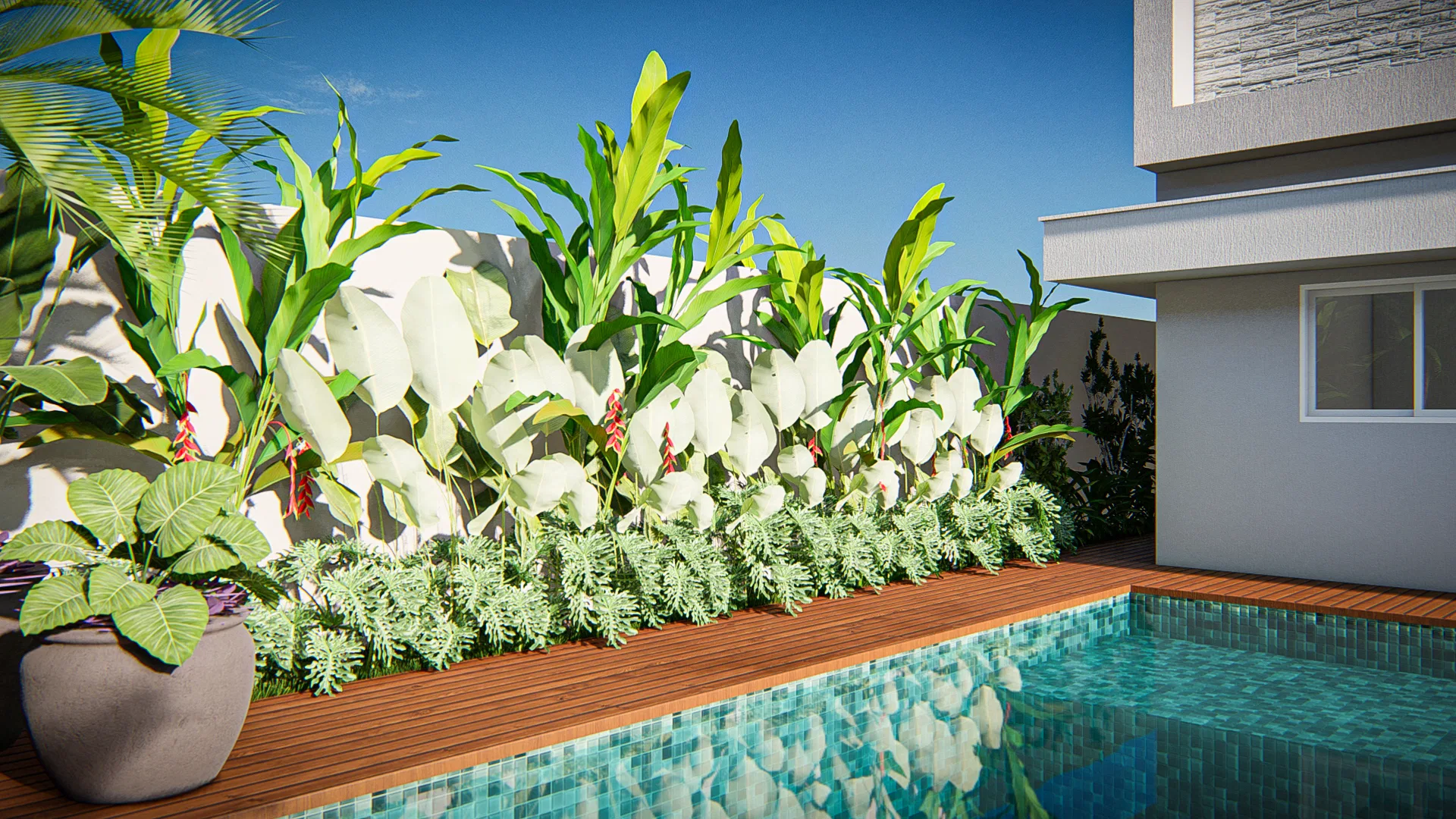Canteiro à beira da piscina com folhagens creme variegadas, helicônias de brácteas vermelhas e forração densa sobre o deck de madeira.