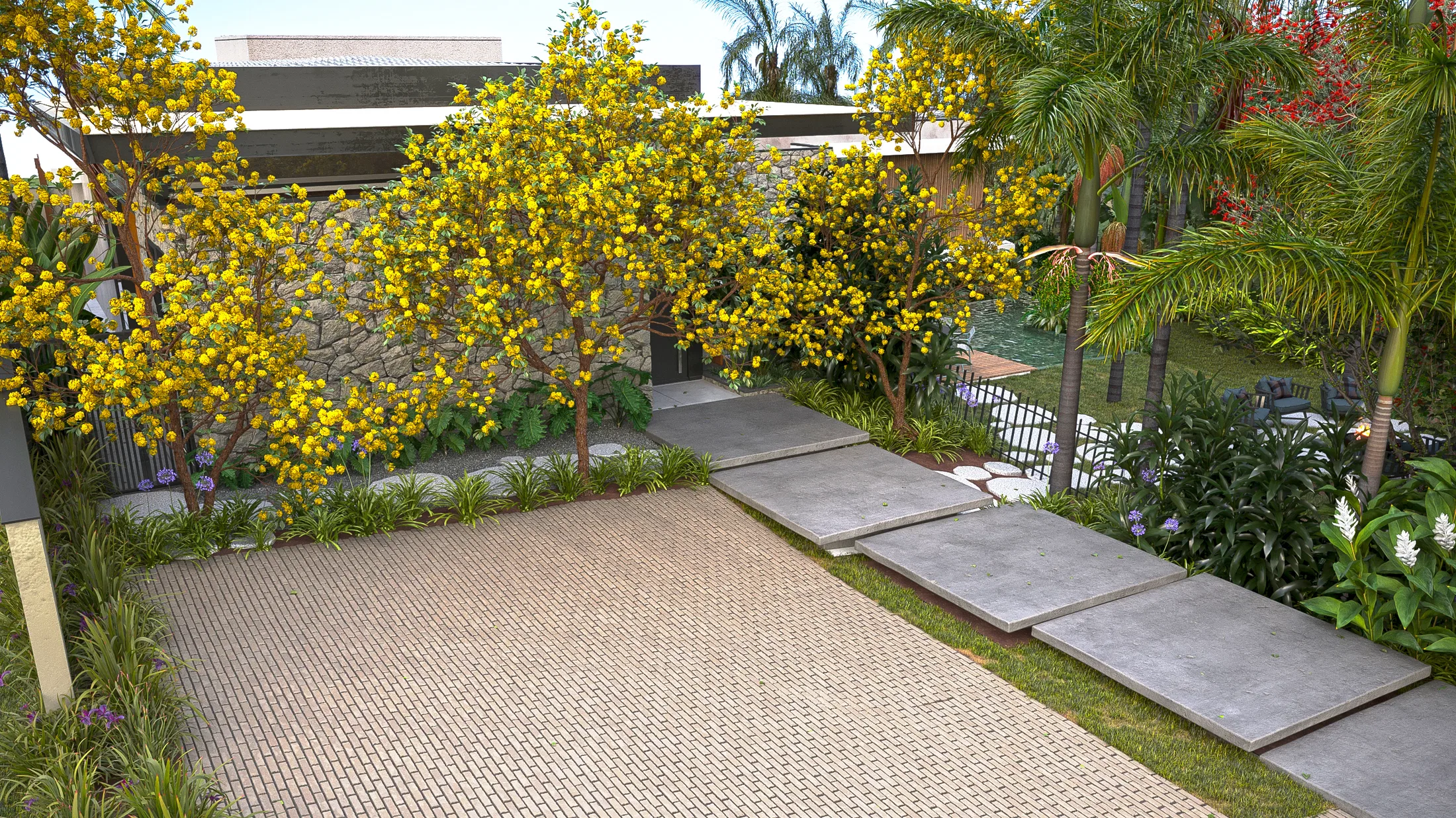 Parede de pedra com árvores de flores amarelas, piso drenante intertravado e grandes placas de pedra sobre a faixa gramada