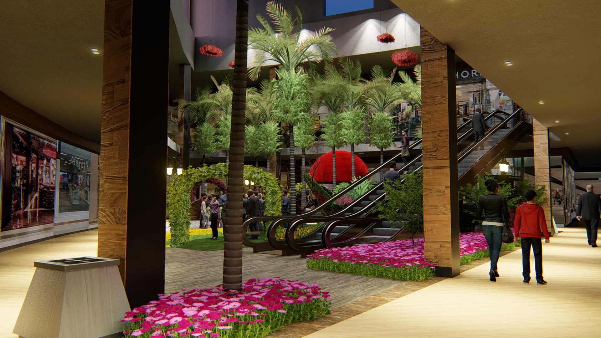 Nível térreo do mall com palmeira alta em canteiro de flores magenta, escadas rolantes ao fundo e pingentes vermelhos suspensos do teto