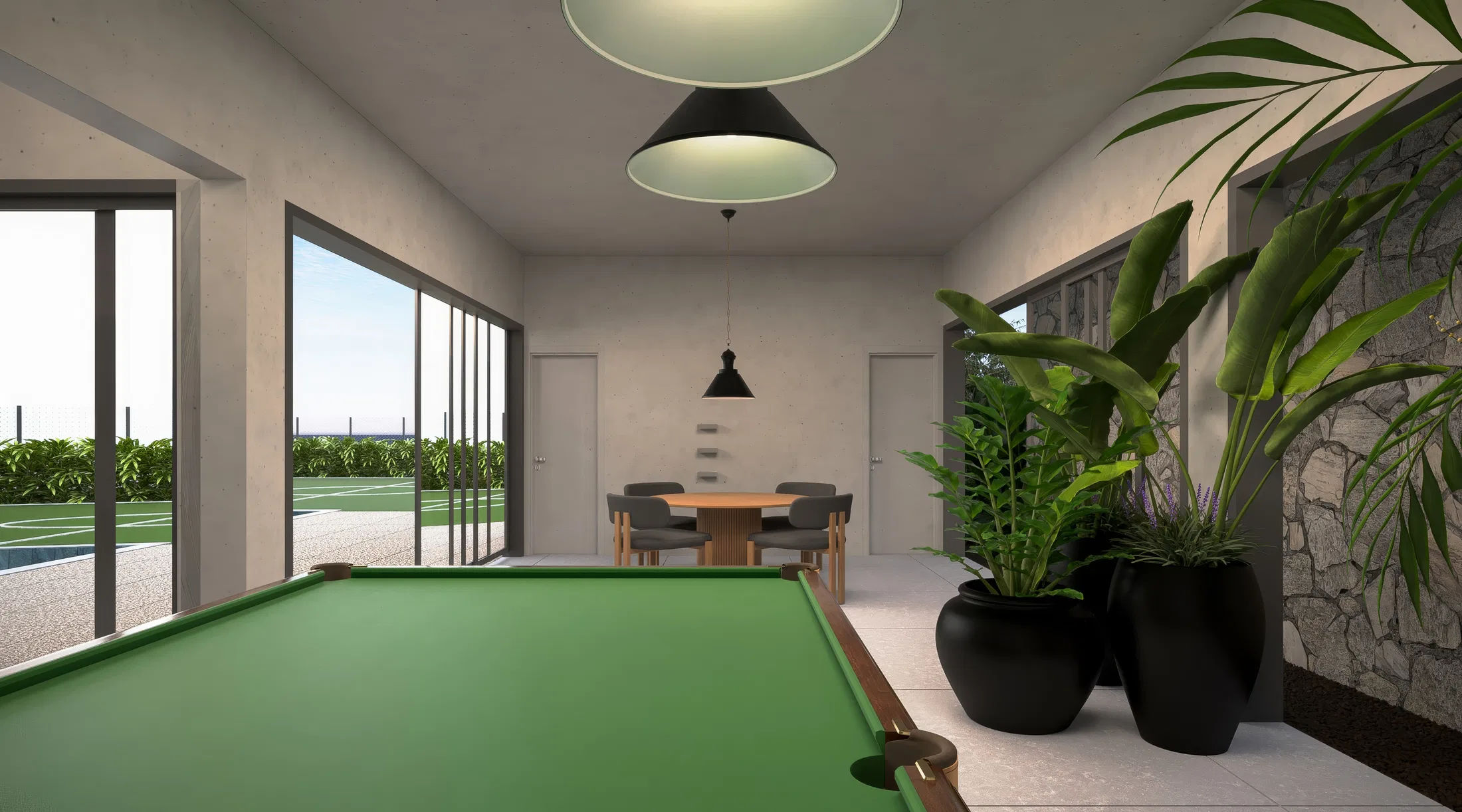 Salão de jogos com mesa de bilhar de feltro verde, luminárias pretas cônicas, portas de vidro para o jardim e parede de pedra com vasos