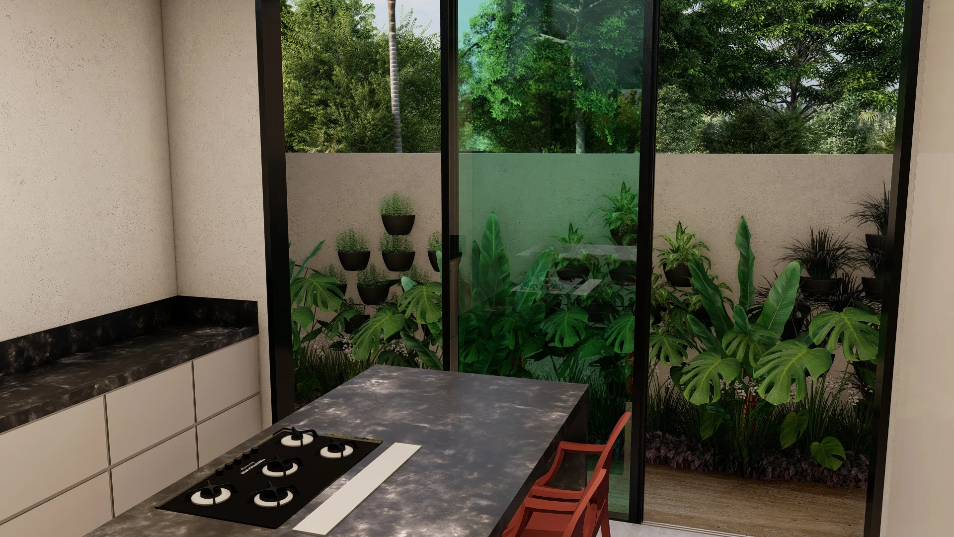 Cozinha com ilha em pedra escura e cooktop, cadeira vermelha e parede de vidro emoldurando um jardim de vasos de gramíneas, monsteras e folhagens tropicais