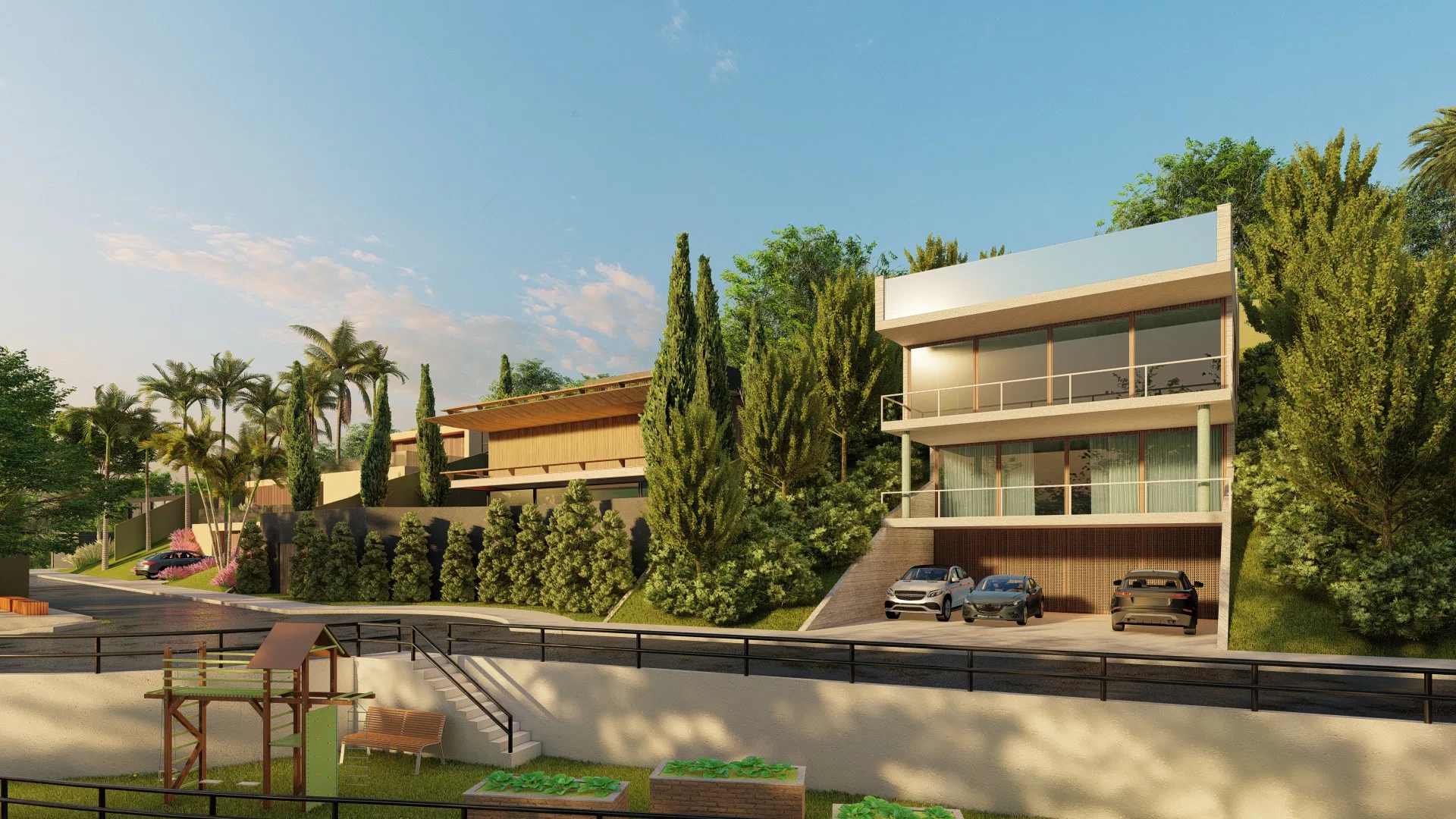 Casa de três níveis com varandas envidraçadas vista de um playground de madeira, entre ciprestes e palmeiras ao anoitecer