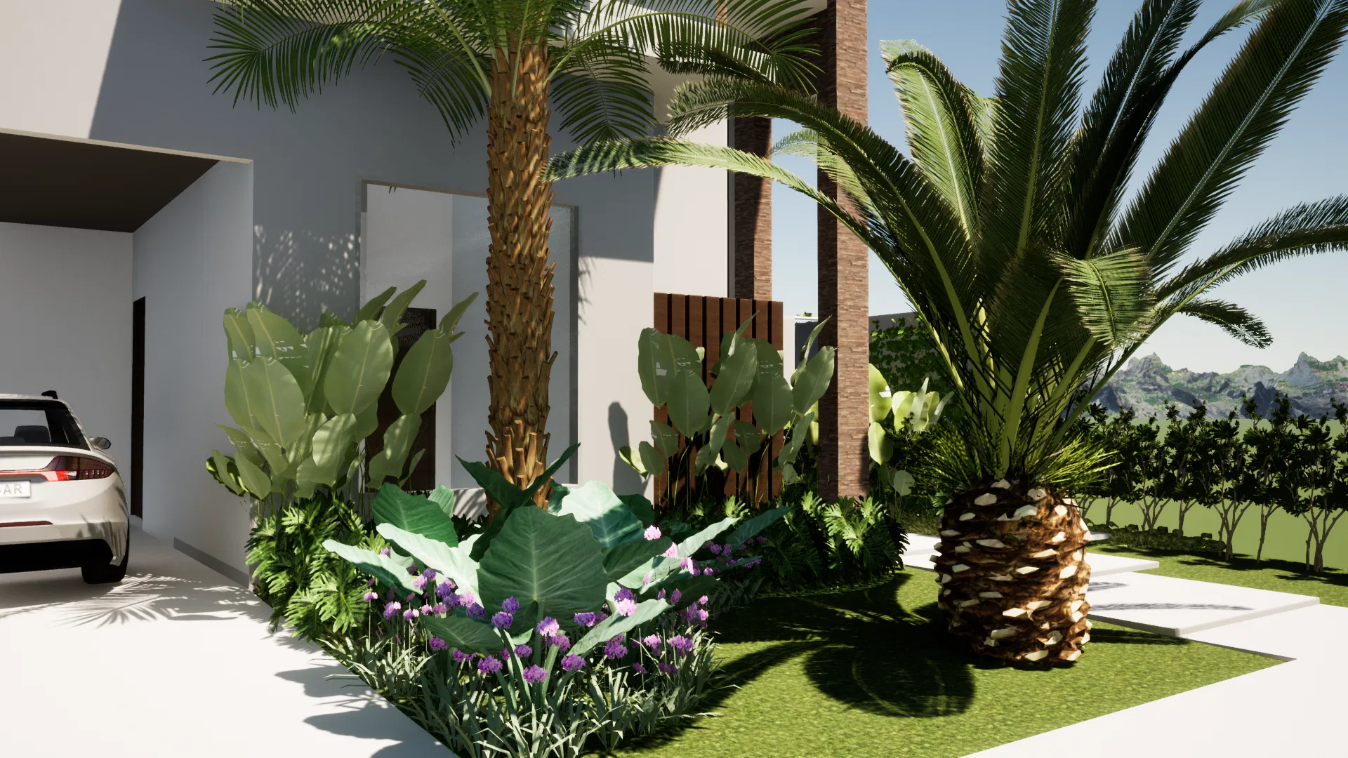 Detalhe do jardim de entrada com palmeira de tronco robusto, folhas de bananeira, cactos no muro de pedra e forração de flores roxas.