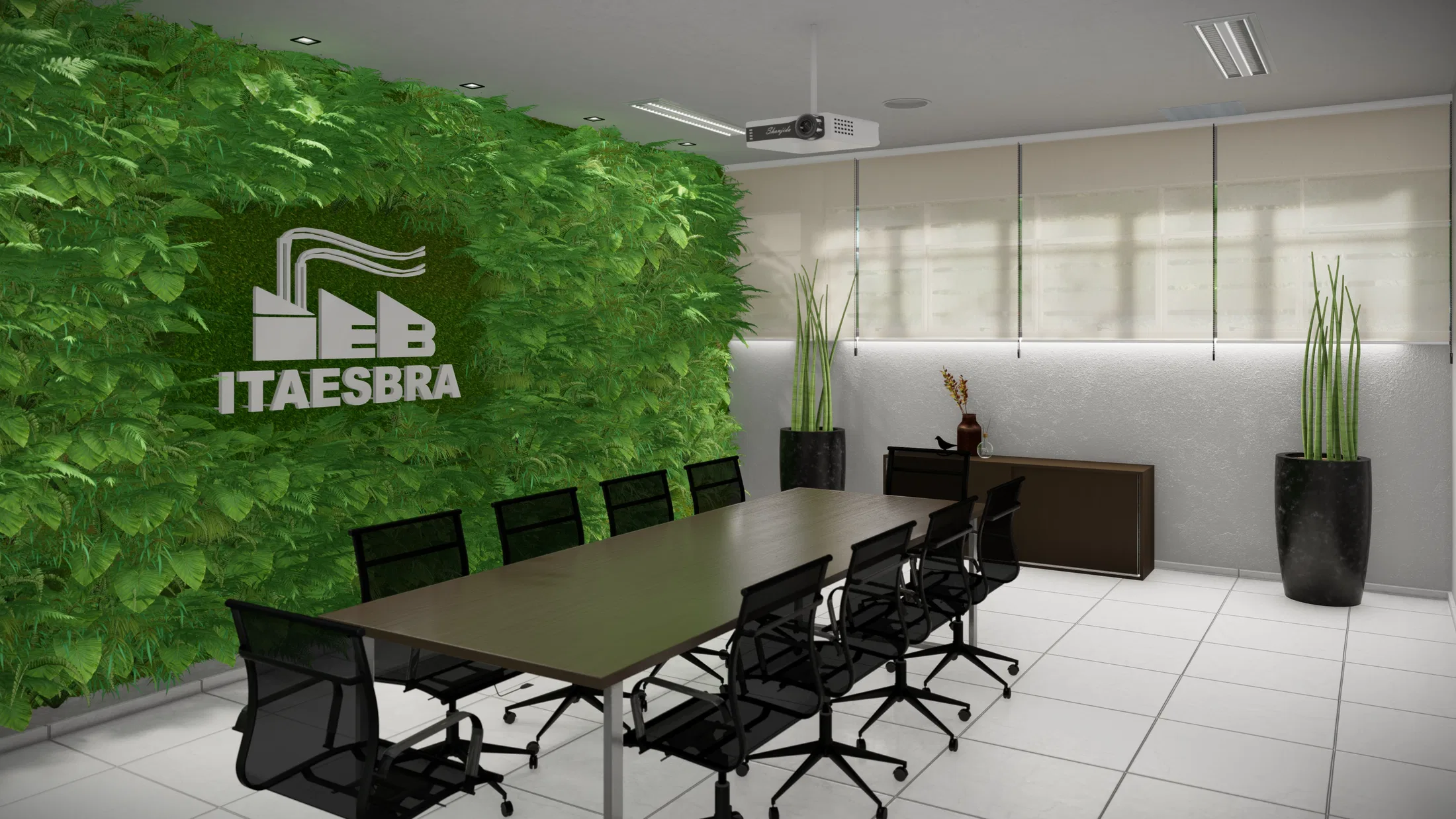 Vista angular da sala de reunião, com a parede verde e o logotipo envolvendo a esquina, mesa longa e espadas-de-são-jorge em vasos pretos altos
