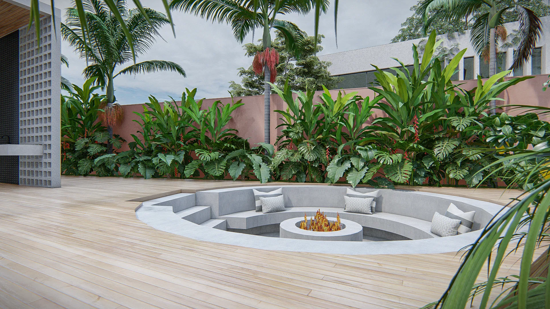 Fire pit circular embutido no deck, com assentos de concreto e almofadas, cercado por folhagens tropicais
