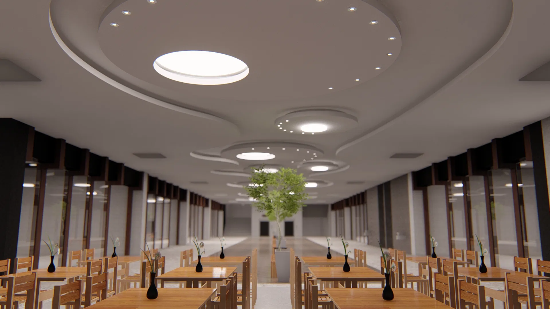 Perspectiva do hall ao longo das mesas de madeira, com vasos escuros, forro circular iluminado e uma árvore central marcando o eixo do salão.