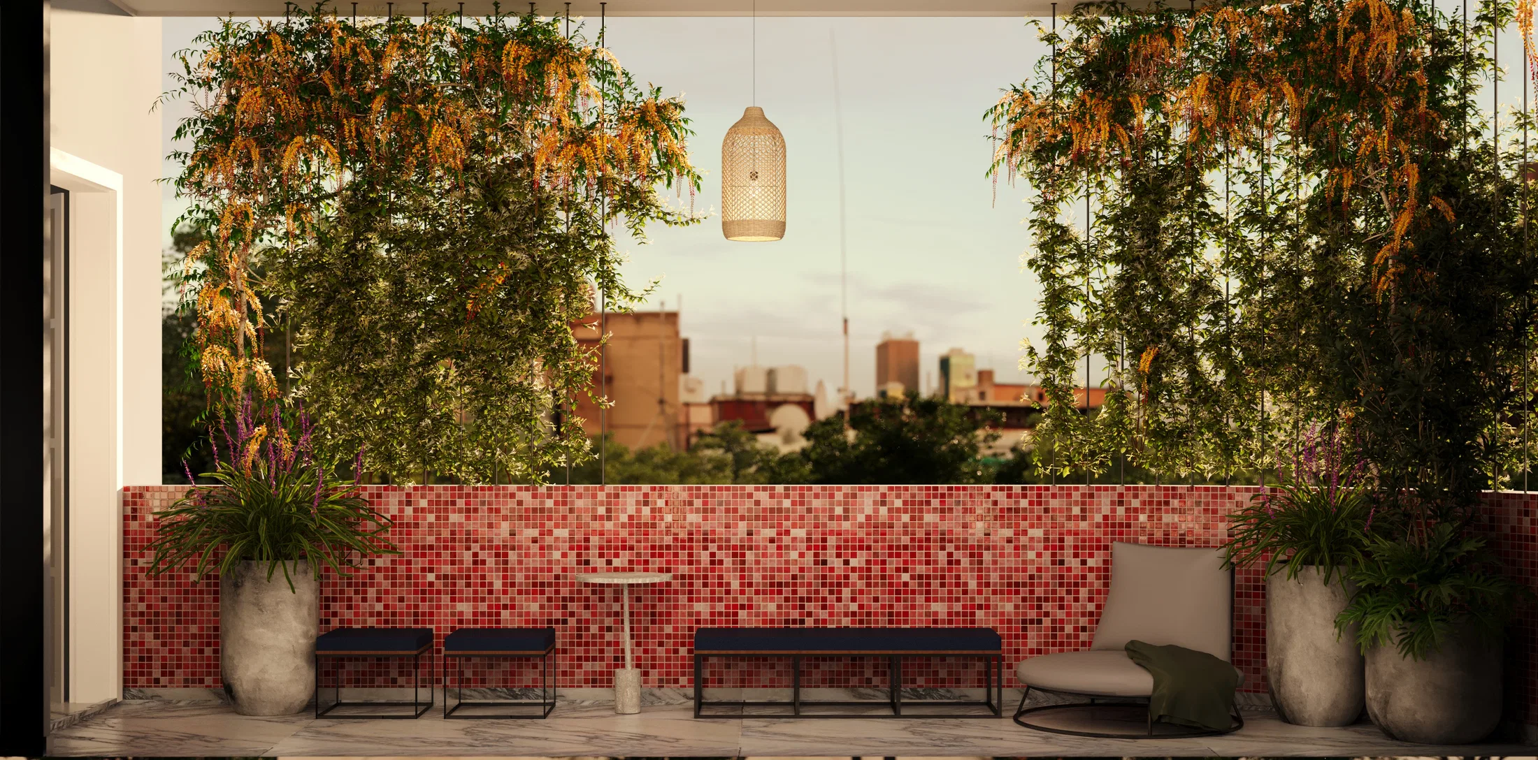 Varanda gourmet com revestimento em pastilha vermelha, bancos, poltrona e trepadeiras suspensas emoldurando a vista da cidade ao entardecer