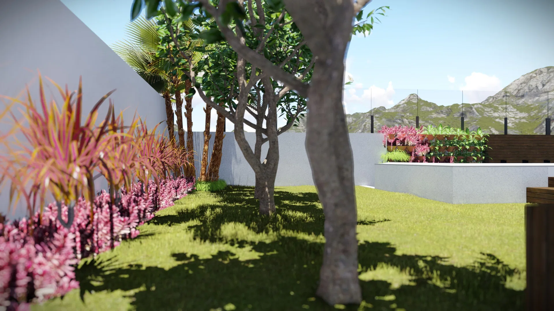Gramado com árvore em primeiro plano, canteiro de flores rosa-magenta junto ao muro e palmeiras, com serra ao fundo além do guarda-corpo de vidro