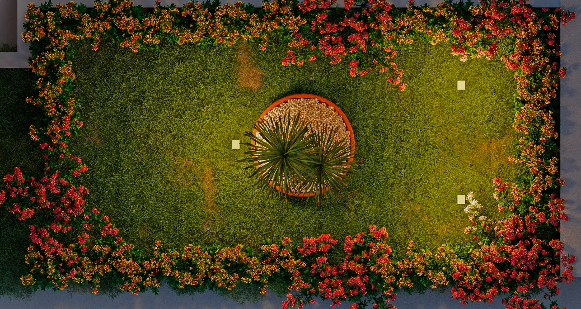 Enquadramento zenital de um gramado contornado por arbustos floridos vermelhos, com um canteiro circular central de folhagem em leque sobre cascalho.
