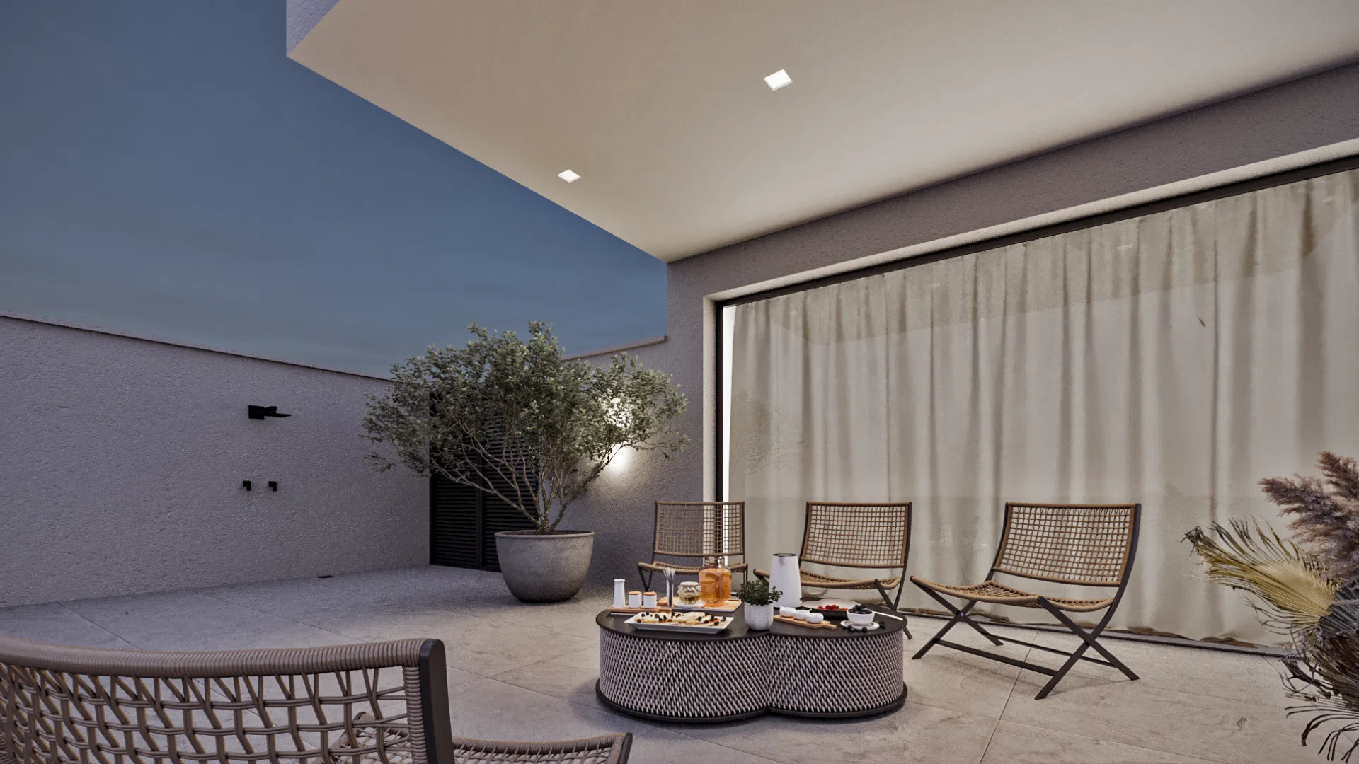 Área de estar coberta com rede suspensa, poltronas trançadas e mesa de centro voltadas para jardim iluminado