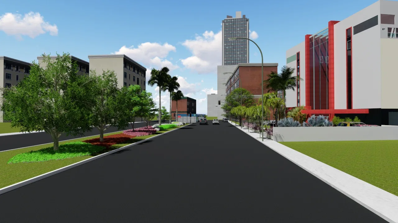 Avenida asfaltada com canteiro central florido, palmeiras e árvores, ladeada por edifícios urbanos e uma torre ao fundo sob céu azul.