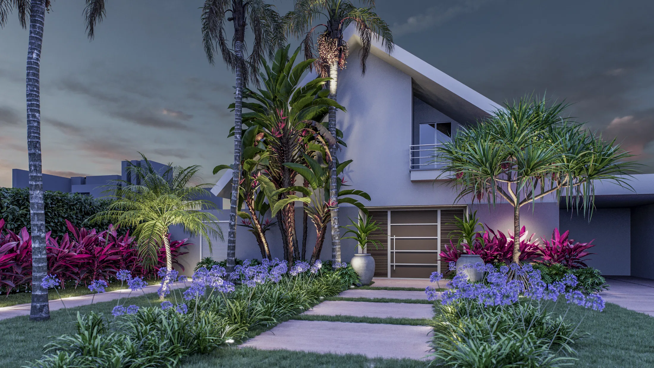 Mesma casa ao entardecer com agapantos azuis floridos margeando o caminho, palmeiras iluminadas e canteiros de folhagem colorida junto à entrada