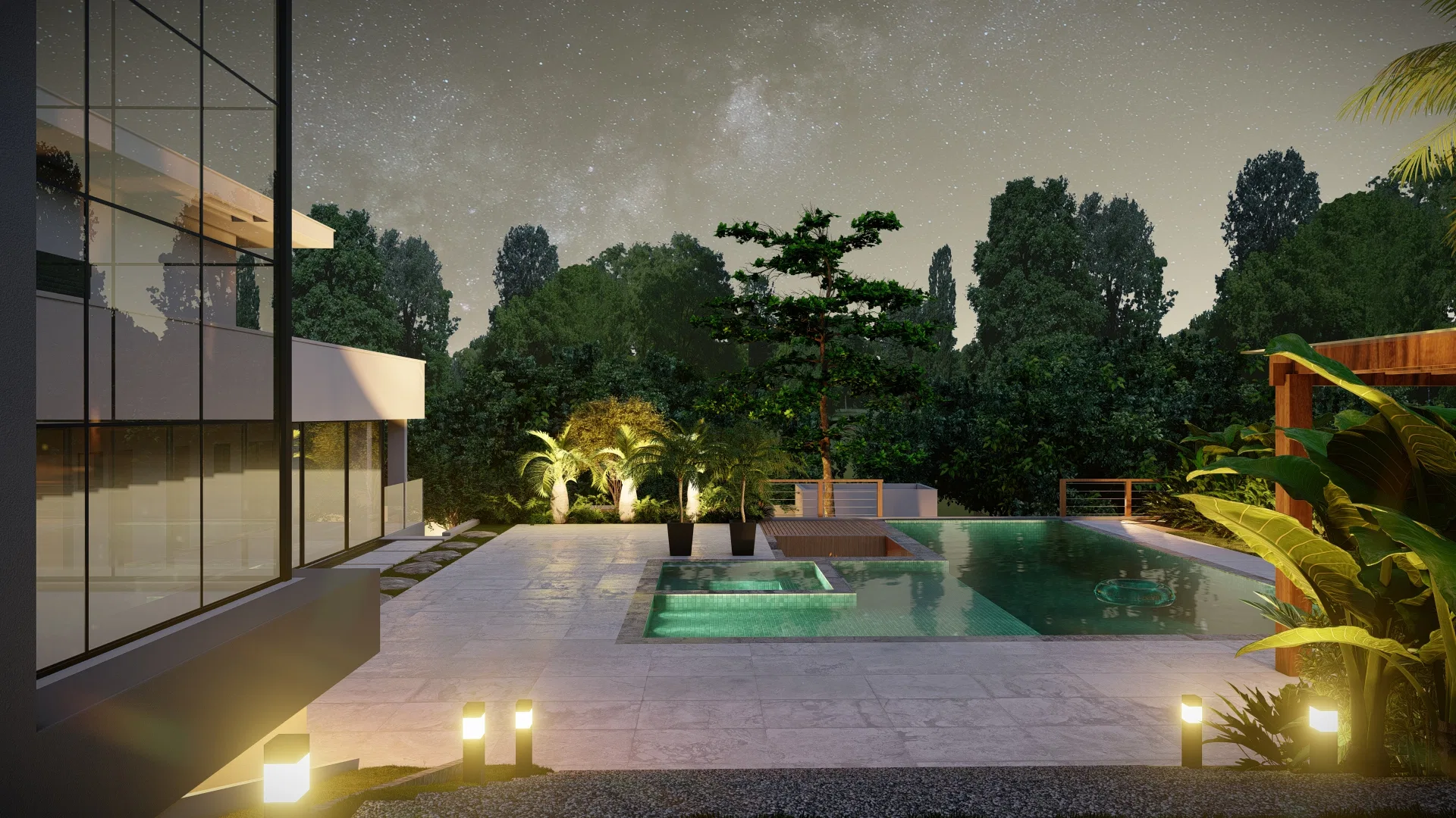 Piscina integrada a spa elevado em frente à fachada envidraçada da casa, piso em pedra clara e palmeiras ao fundo, à noite
